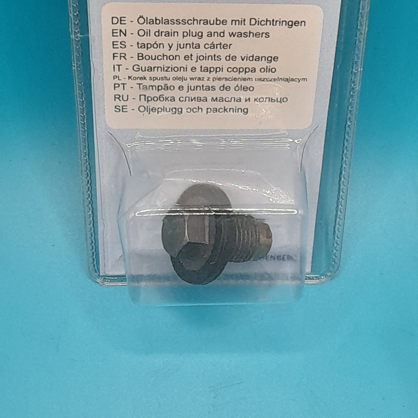 The image shows a Mini Cooper oil pan drain plug, packaged in a clear plastic case with a label detailing the product's specifications and compatibility with various Mini Cooper models.