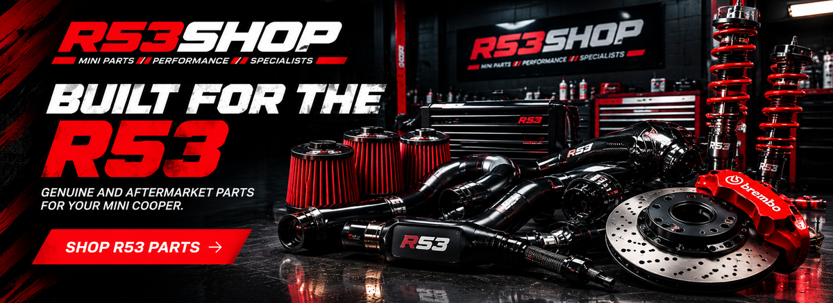 R53 Shop Mini Parts, showcasing various automotive performance parts including a intake manifold,air filters, a drilled brake rotor, and a red suspension coil over, set in workshop with R53Shop branding.