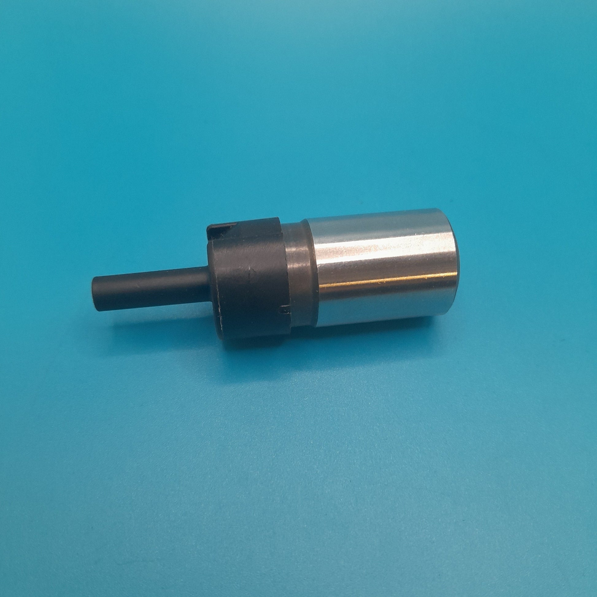A silver-colored Engine Timing Chain Tensioner for gen1 mini coopers R50,R52 and R53 models