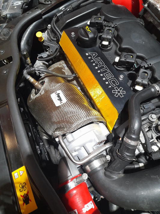 A Forge Motorsport turbo blanket installed on the engine bay of a Mini Cooper s turbo