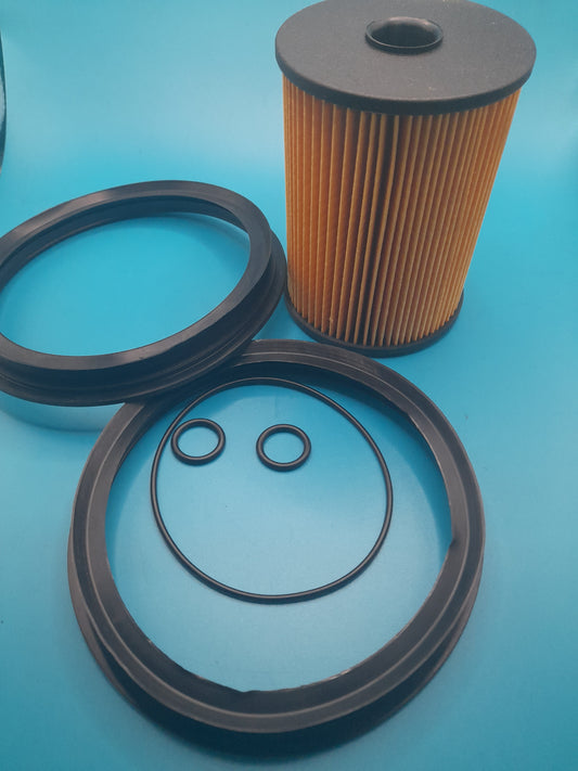 A fuel filter with two rubber seals and two rubber rings, primarily orange in color, designed for a Gen 1 Mini Cooper.R50,R52 AND R53