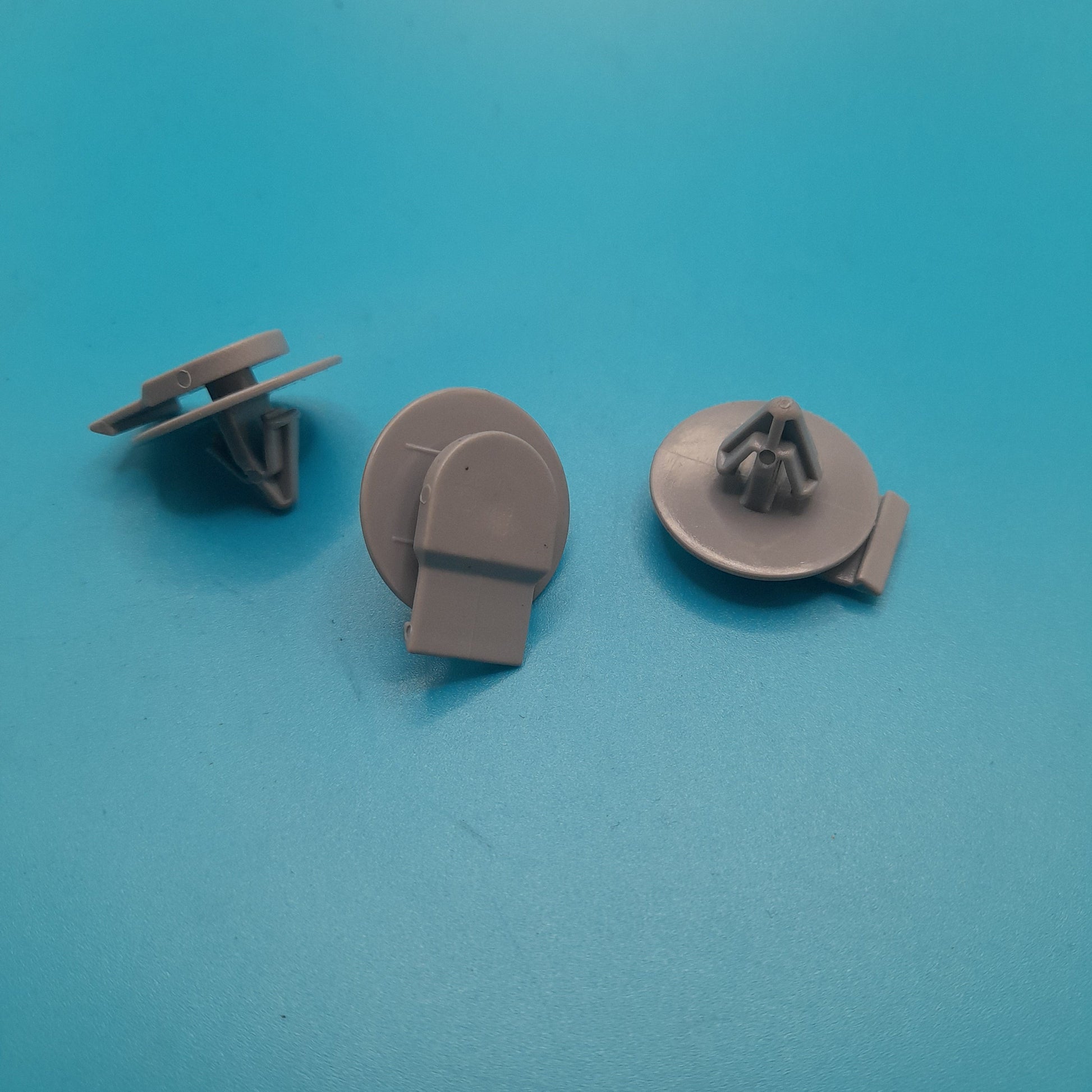 Three gray exterior arch clips for a Gen 1 Mini cooper R50,R52 and R53 exterior fender arch clips set