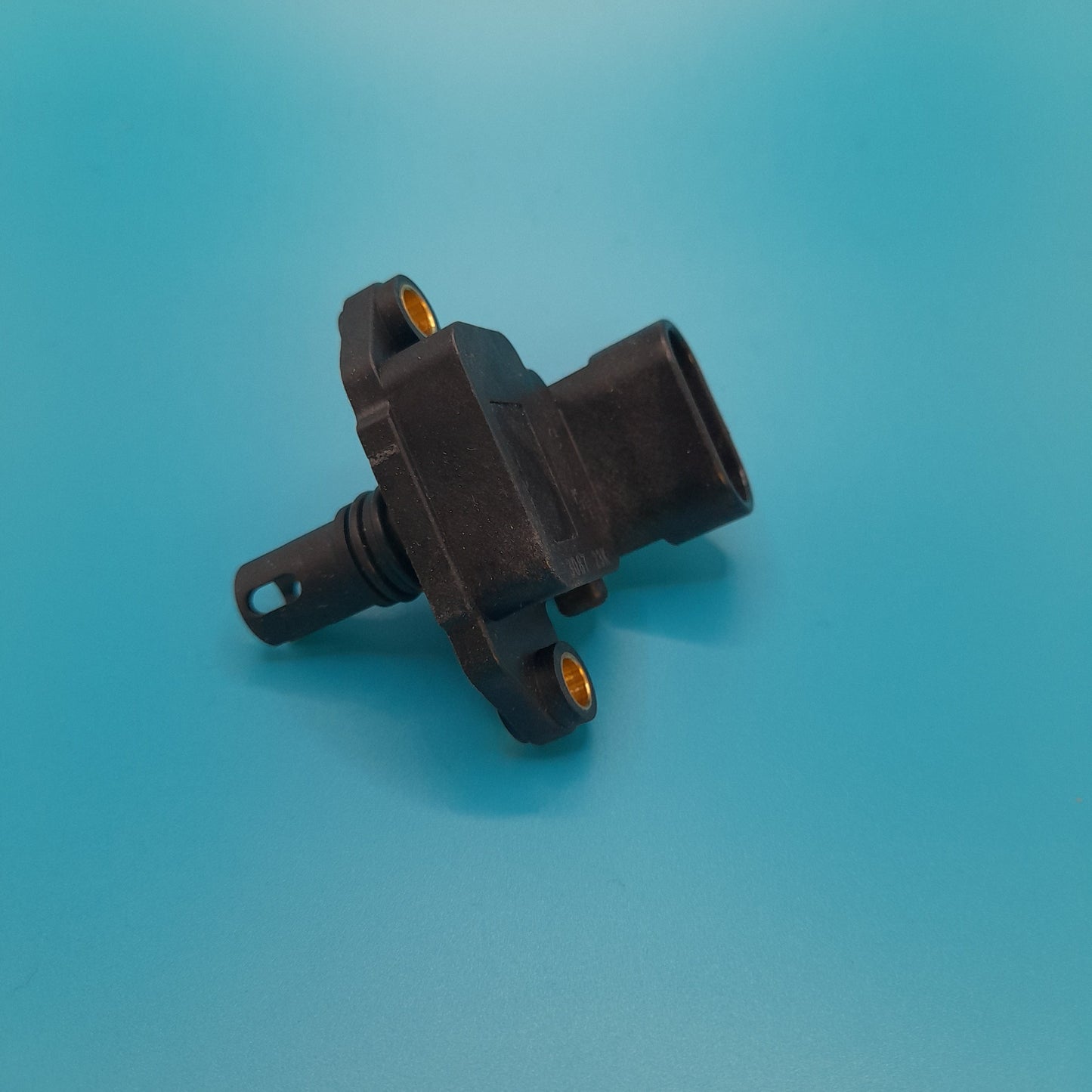 A black map sensor for a Mini Cooper S, placed on a blue background.