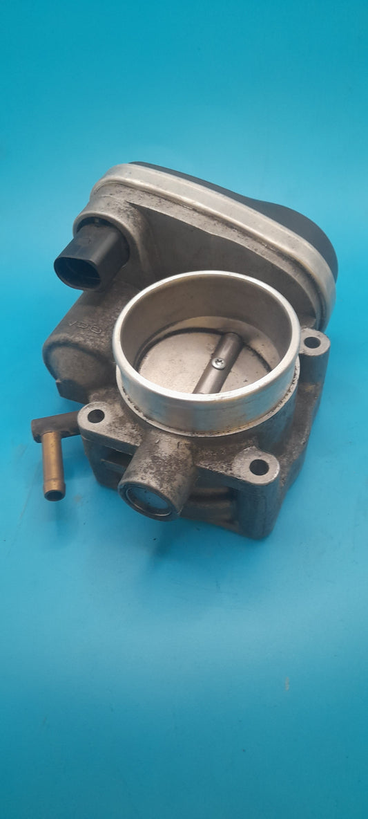 Mechanical throttle body on a blue background
