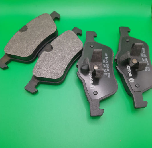 A set of black front Bosch quiet-cast brake pads for mini cooper s R55, R56