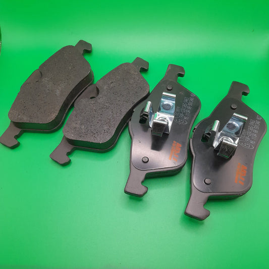 A set of black TRW Ultra brake pads for mini cooper front Bosch brake calipers r55, r56 models