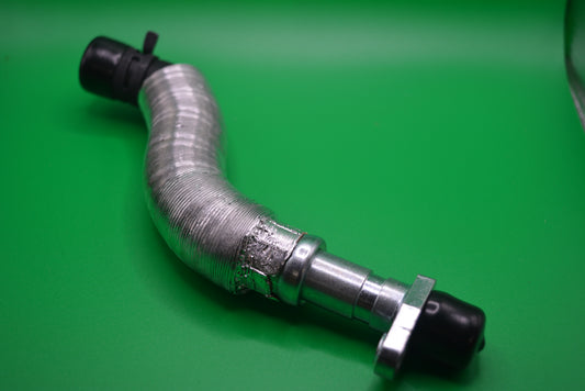 A silver-colored oil drain pipe for a turbo charger of an r56 mini cooper s