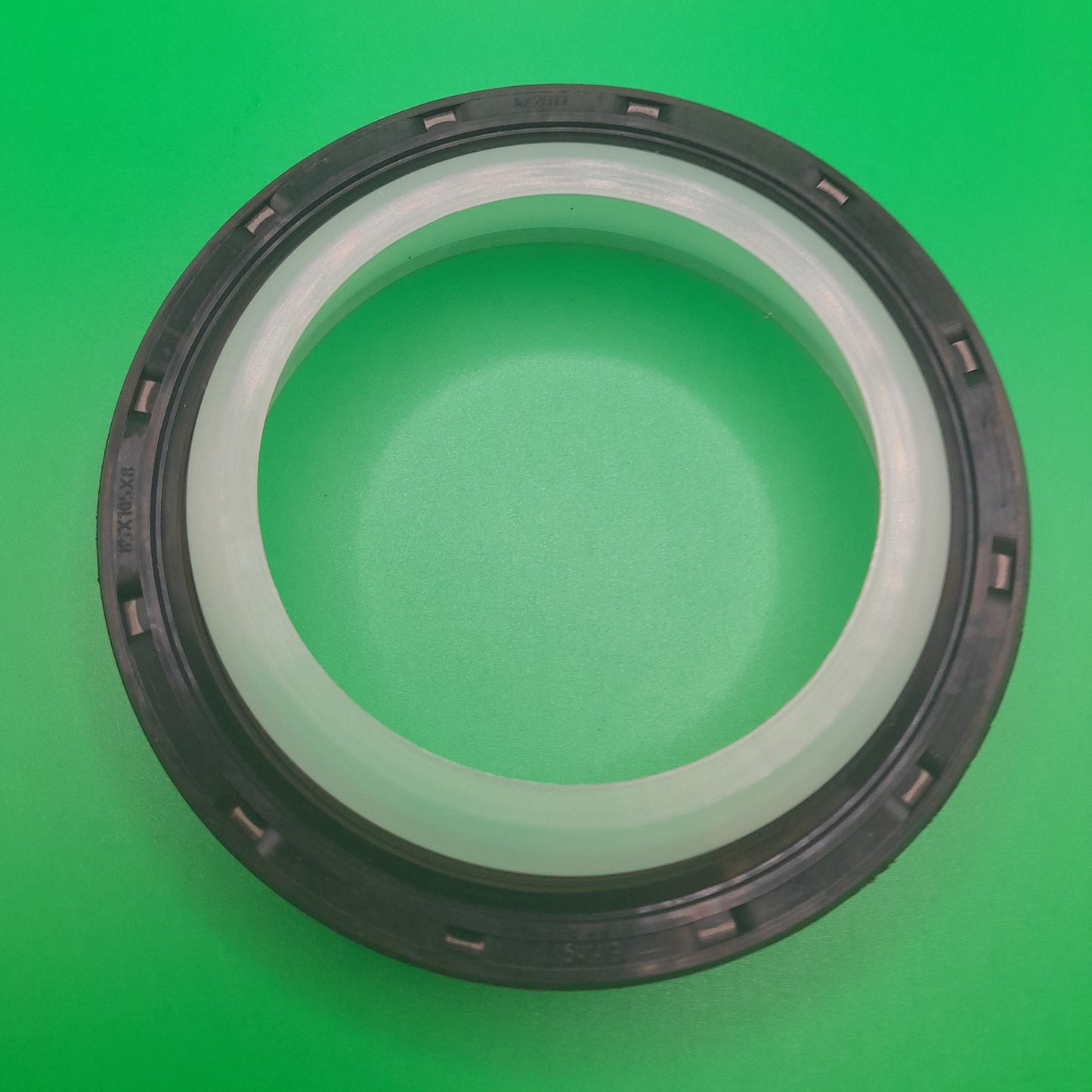 A black and silver rear main seal for a vehicle.