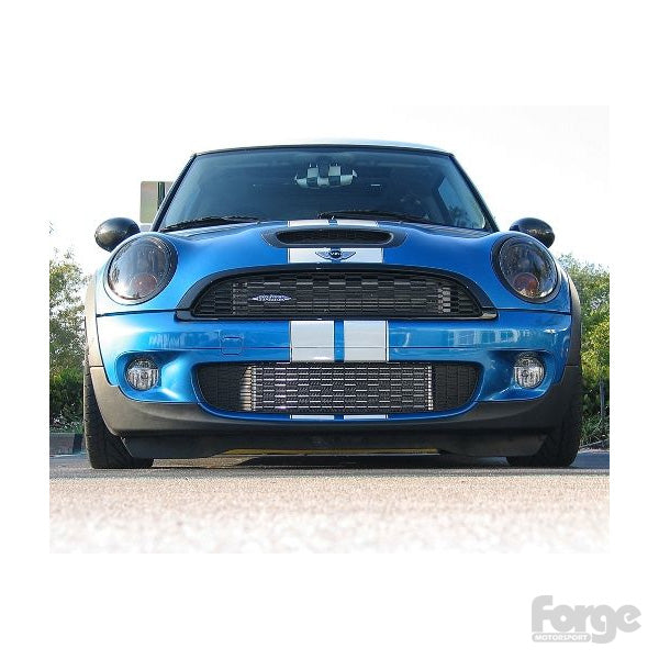 A blue Mini Cooper with the Forge Motosports Front mount intercooler installed on the vehicle.