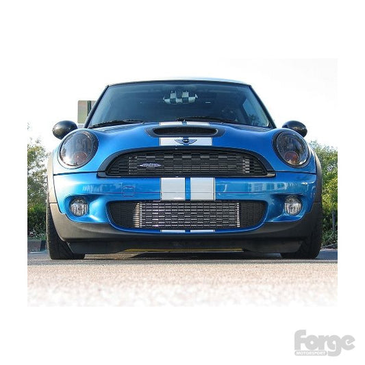 A blue Mini Cooper with the Forge Motosports Front mount intercooler installed on the vehicle.